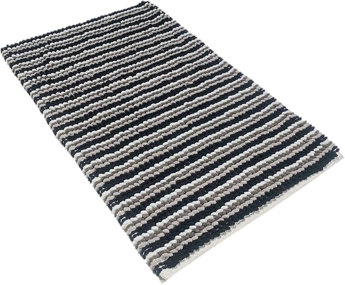Striped rug with black and grey horizontal stripes on a white background