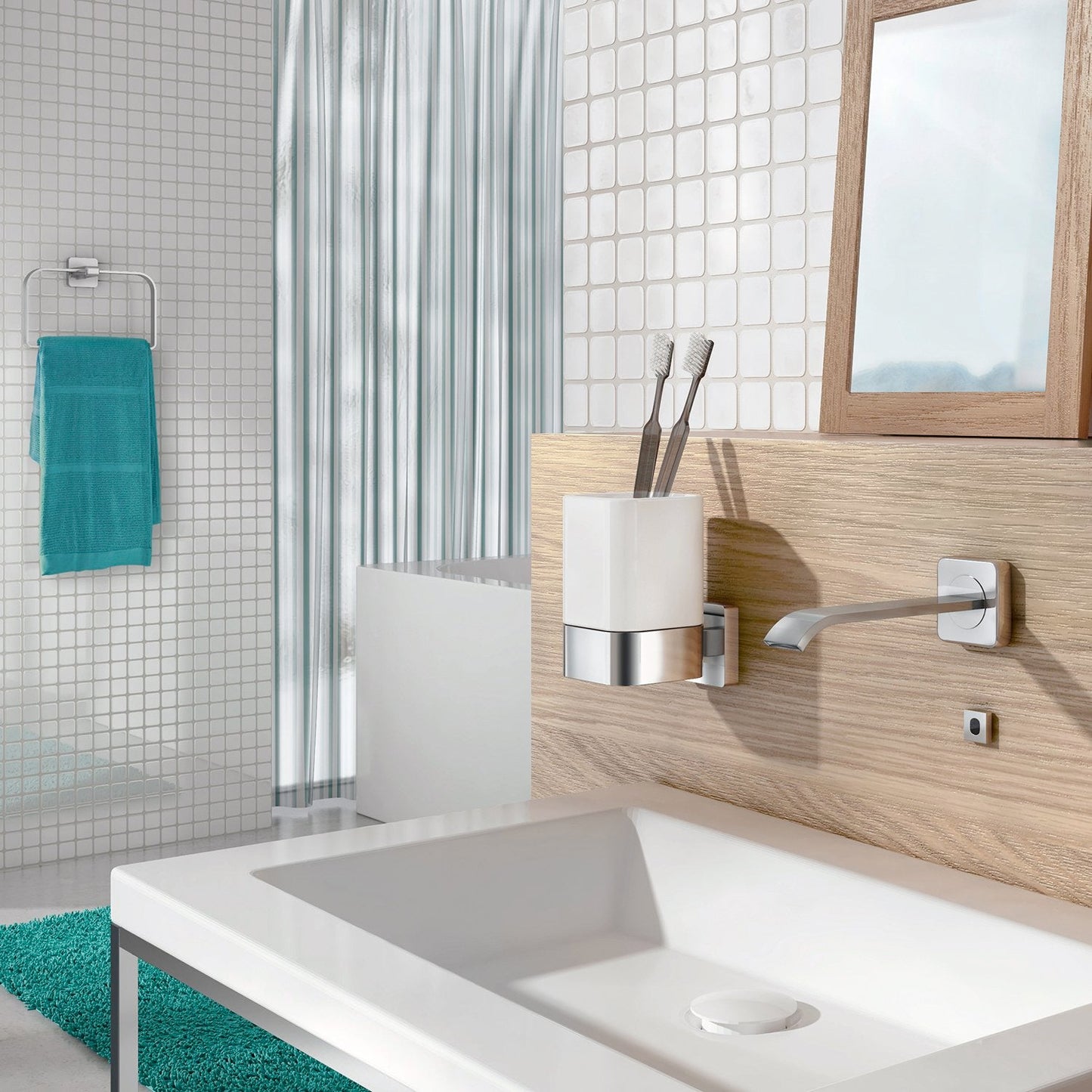 Modern bathroom with sink, mirror, towel rack and toothbrush holder.