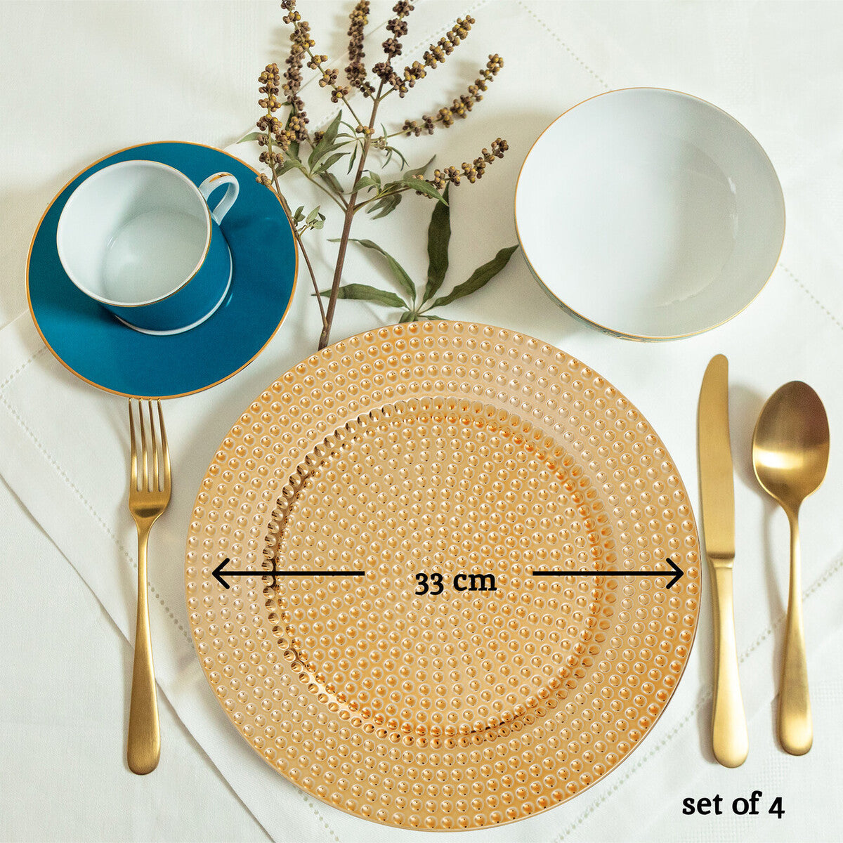 Gold hammered charger plates arranged together showing the matching set