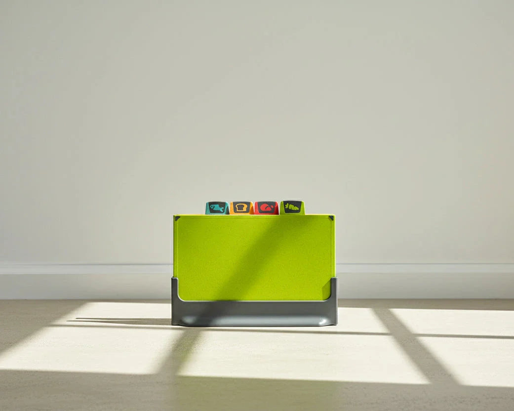 Green cutting board on a light grey surface and white wall background