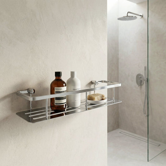 Smedbo Sideline DK3005 Wide Polished Chrome Shower Basket — Wall-Mounted on Textured Plaster Wall Beside Frameless Glass Shower, Styled with Aesop Shampoo, Conditioner and Soap Bar