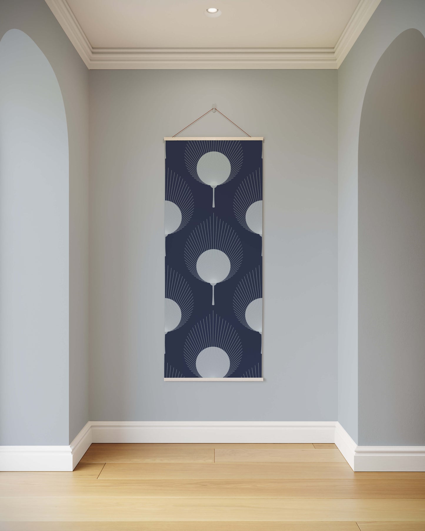 Decorative wall hanging with geometric pattern on a light gray wall.
