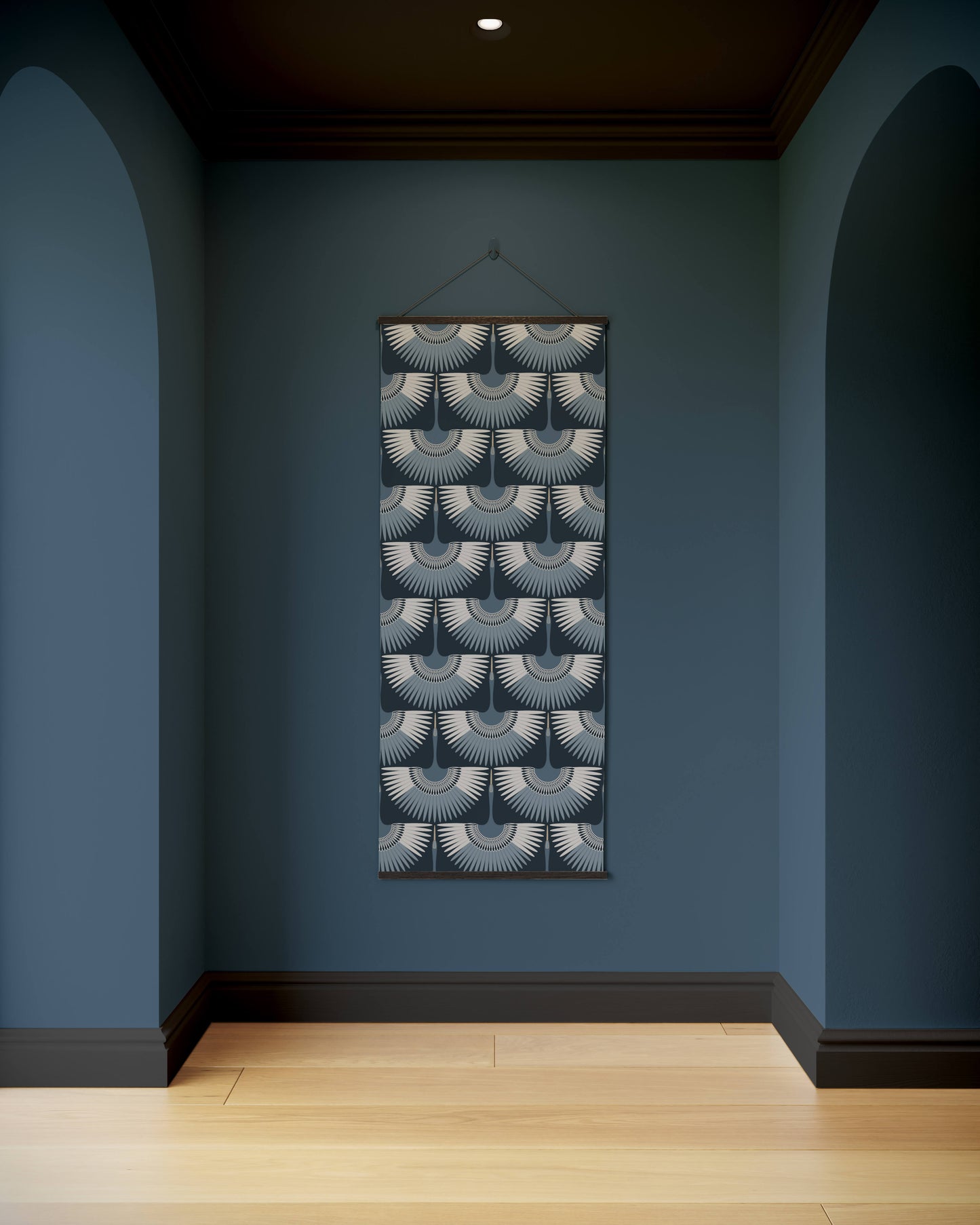 Decorative wall hanging with geometric pattern on a blue wall.