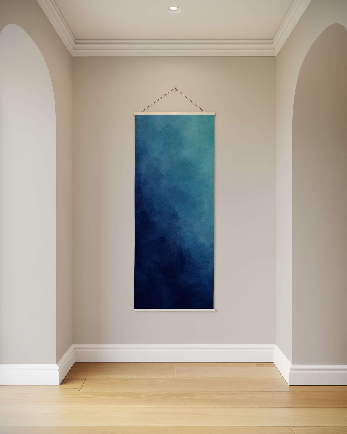 Blue abstract painting hanging on a wall in a room with wooden flooring.