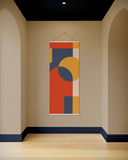 Colourful abstract wall hanging on a beige wall with arches and a dark ceiling.