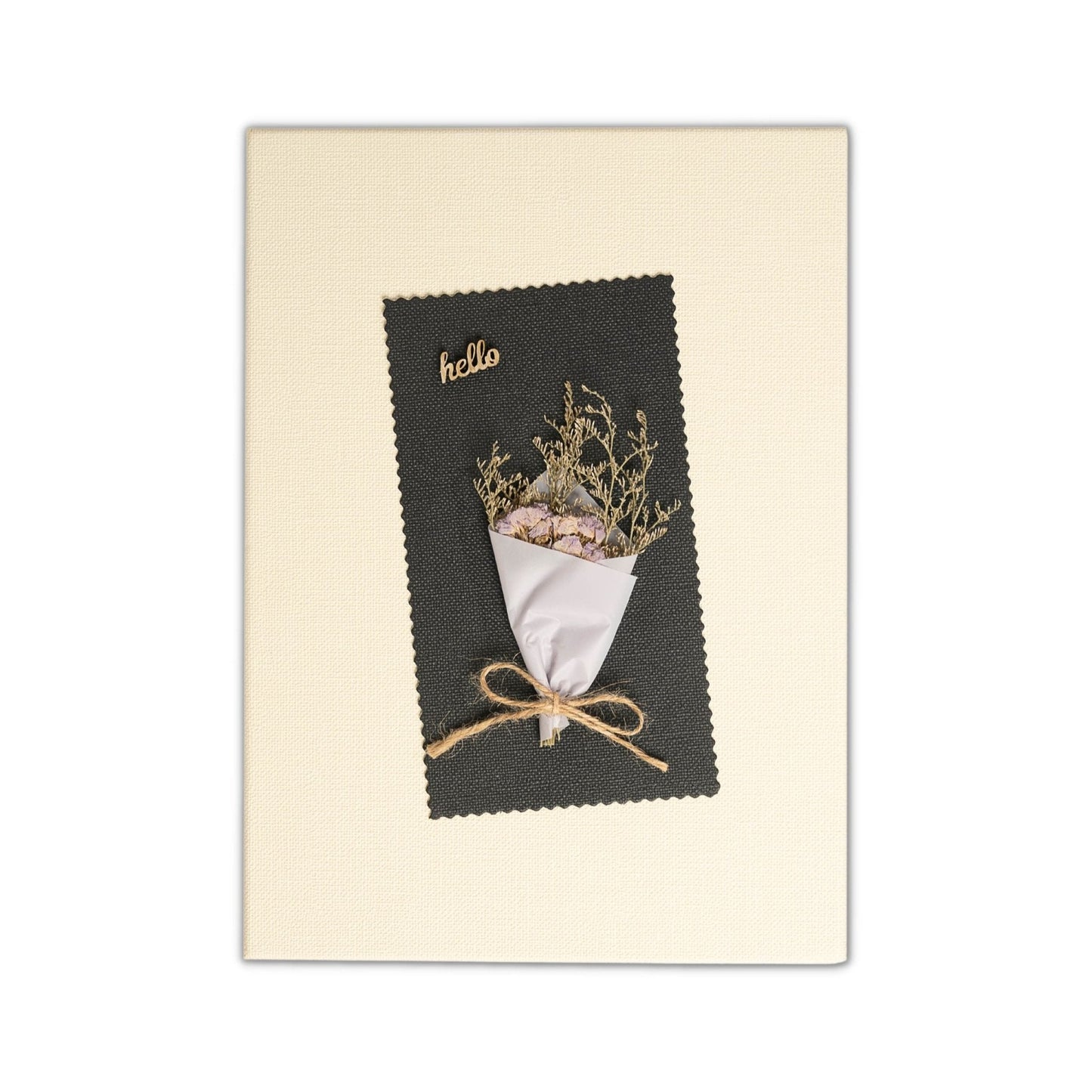Greeting card with a small bouquet of dried flowers on a black card with 'hello' text, on a beige background.
