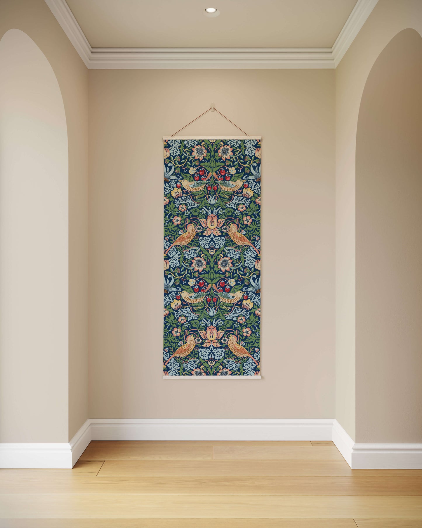 Decorative floral tapestry hanging on a beige wall with wooden floor.
