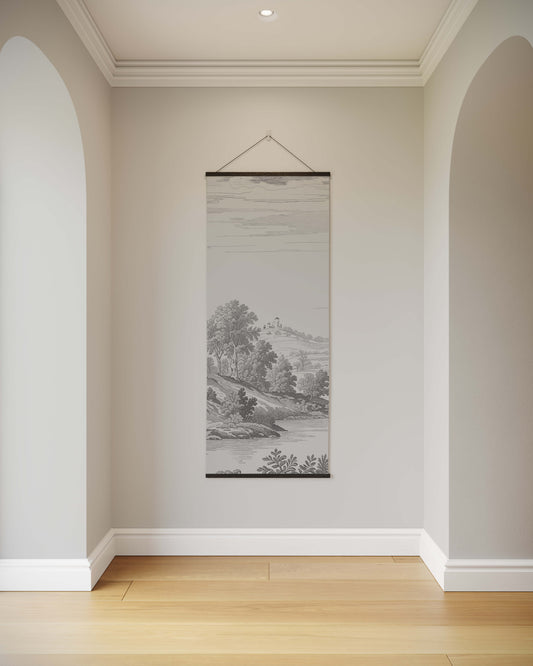Wall art hanging in a room with light-colored walls and wooden floor
