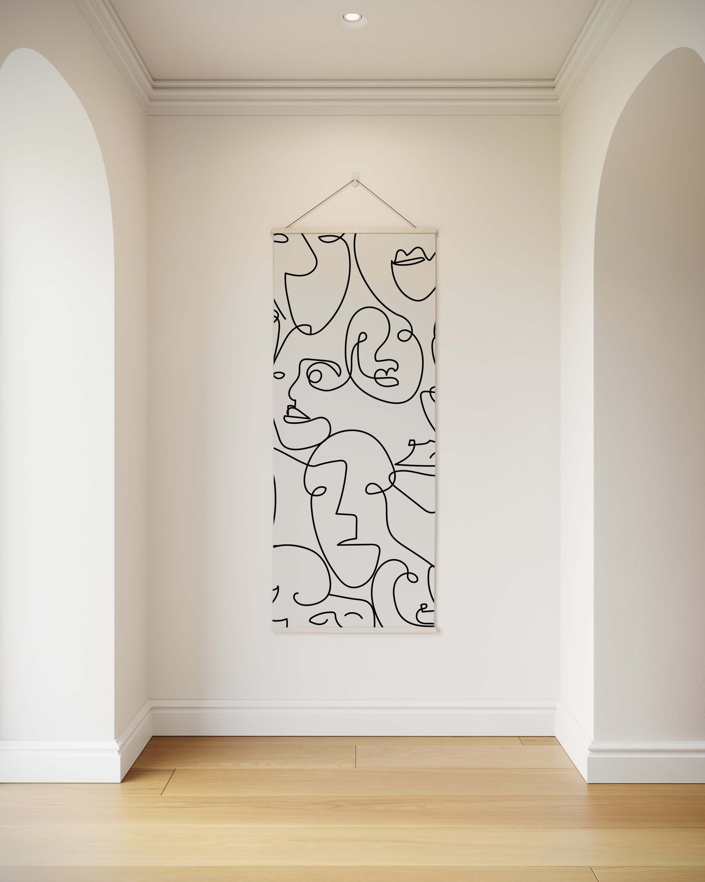 Abstract line art hanging on a wall in a minimalistic room.
