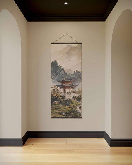 Tapestry of a traditional building in a natural setting hanging on a wall.