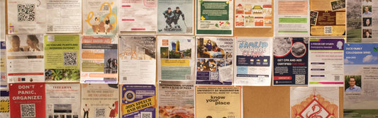 cork notice board densely pinned with flyers and notices
