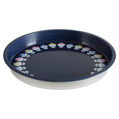 Close-up detail of the mandala motif on the navy serving tray