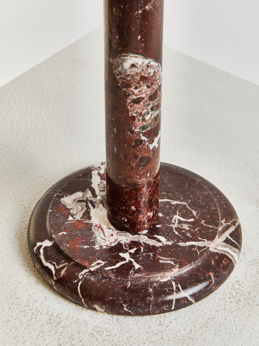 Marble base of a Salmo Red & White Marble Kitchen Roll Holder on a white background