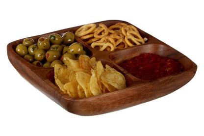 Four section dish styled with olives and nuts
