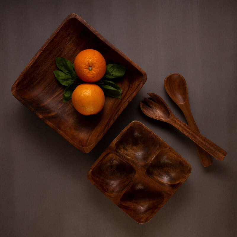 Acacia four section serving dish on a dining table
