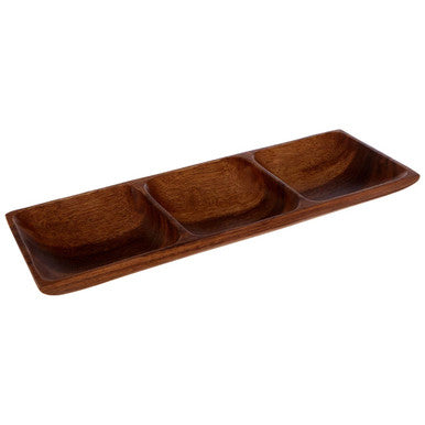 Rectangular serving dish styled with dips and nibbles