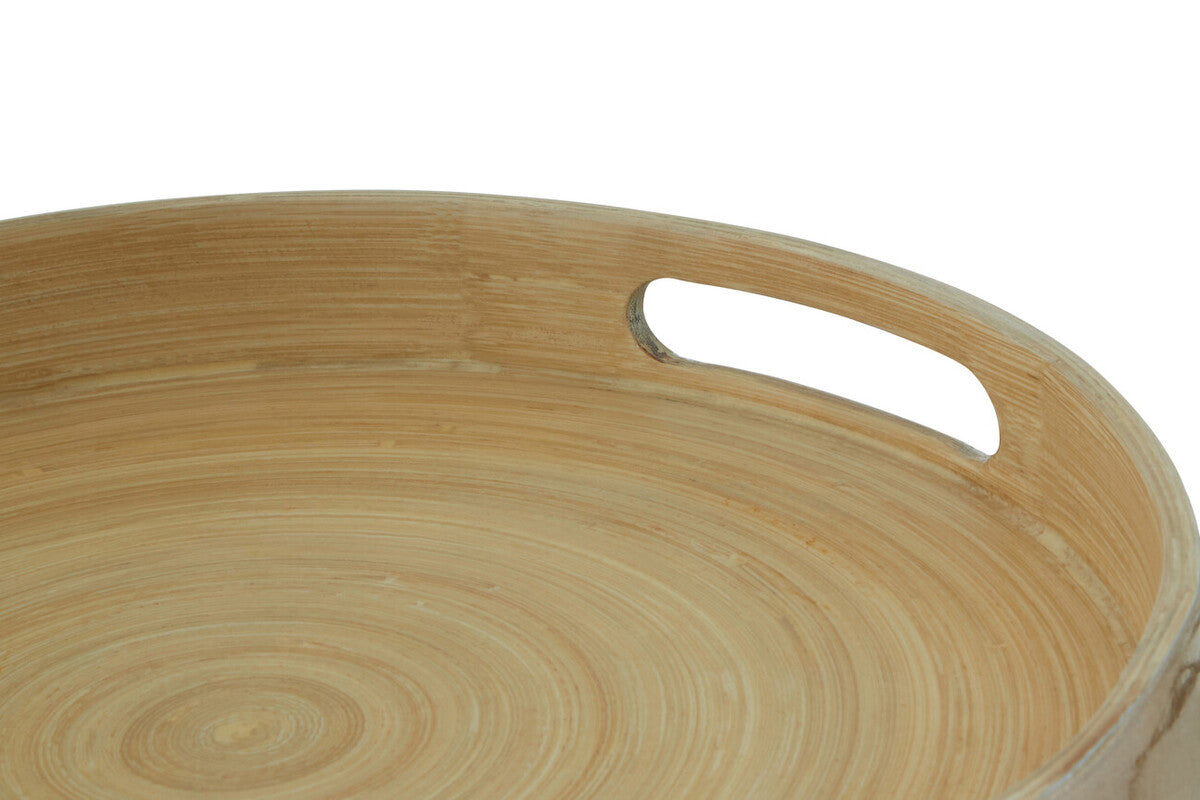 Close-up detail of the gold bamboo tray's cut-out handles