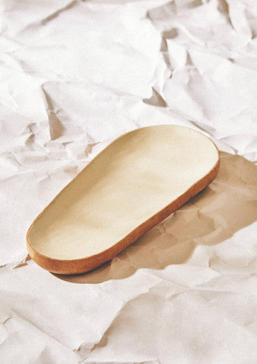 Oval serving dish with enamel interior