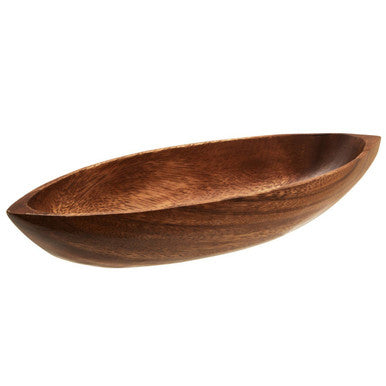 Boat shaped serving dish styled with food
