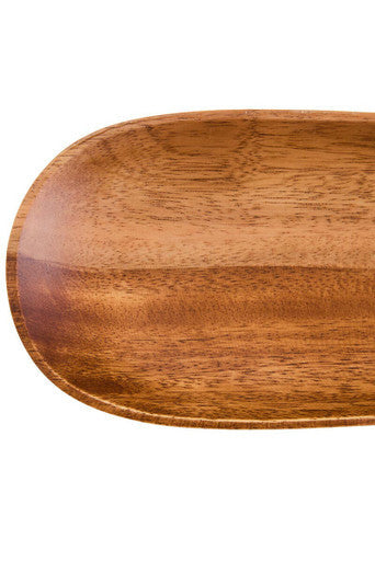 Acacia wood oval dish styled with food on a table