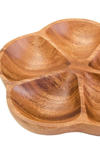Flower serving dish styled with dips and nibbles