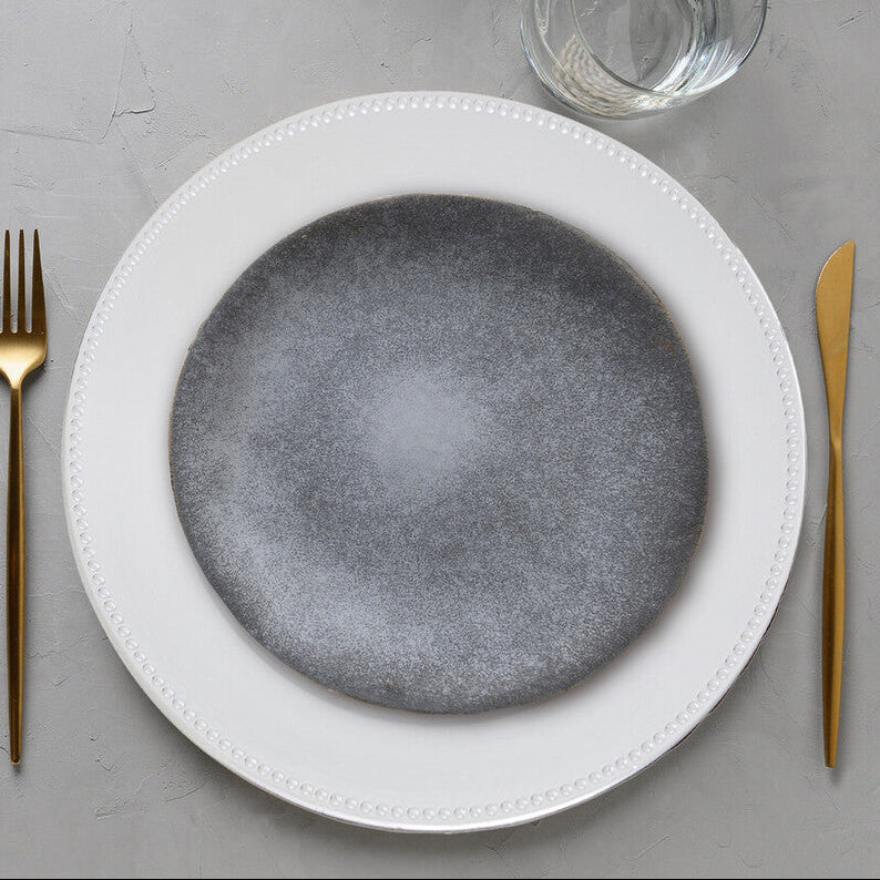 Silver dotted charger plate shown from above