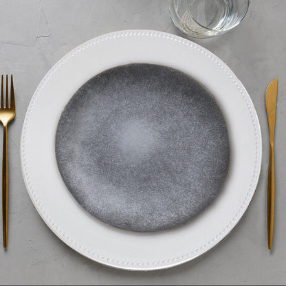Silver dotted charger plate shown from above