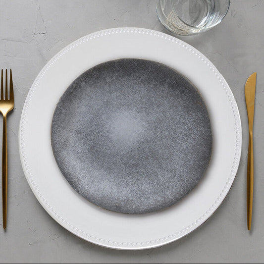 Silver dotted charger plate shown from above