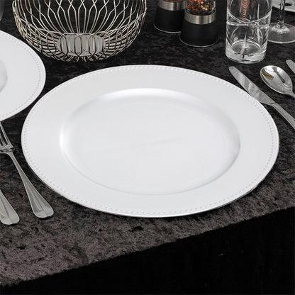 Side view of the silver charger plate showing the dotted rim