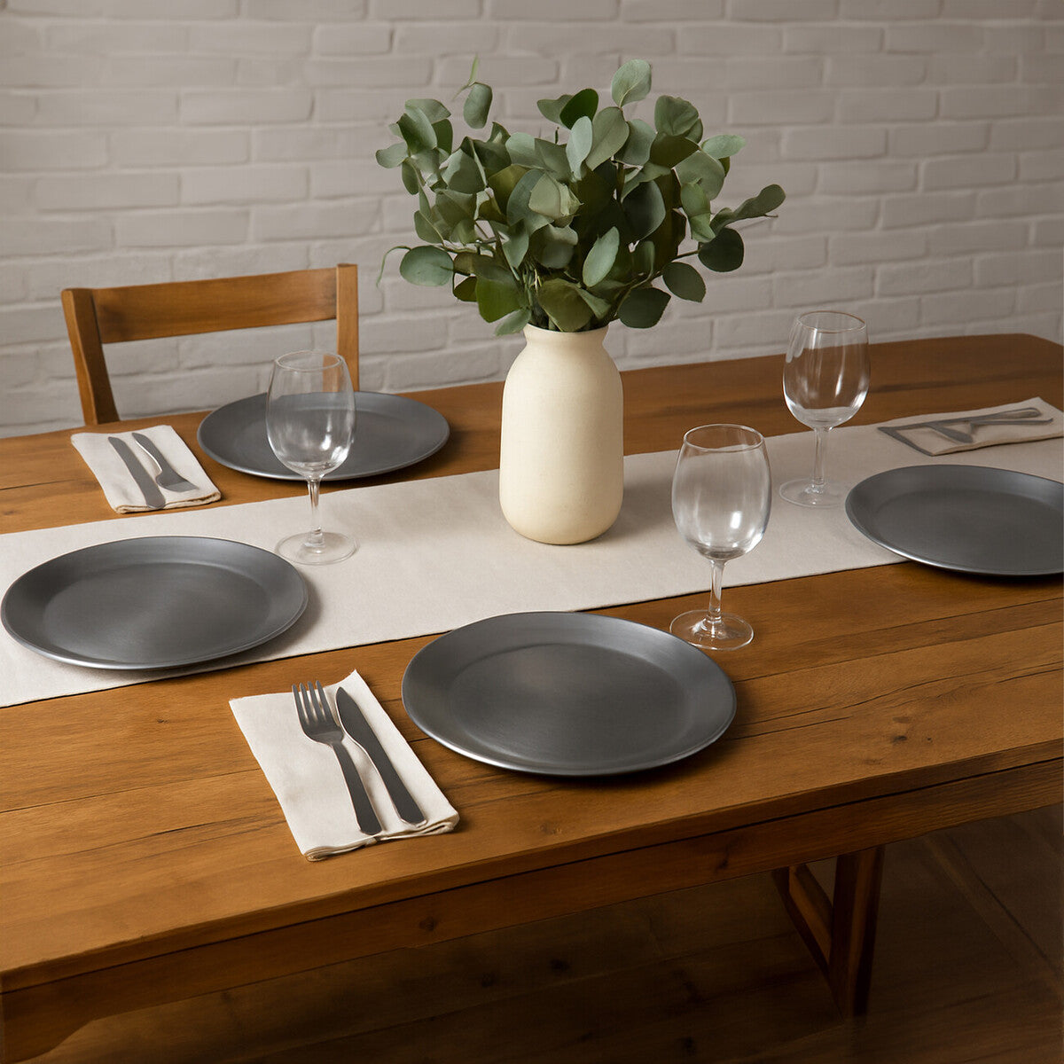 Silver coupe charger plate styled on a dining table