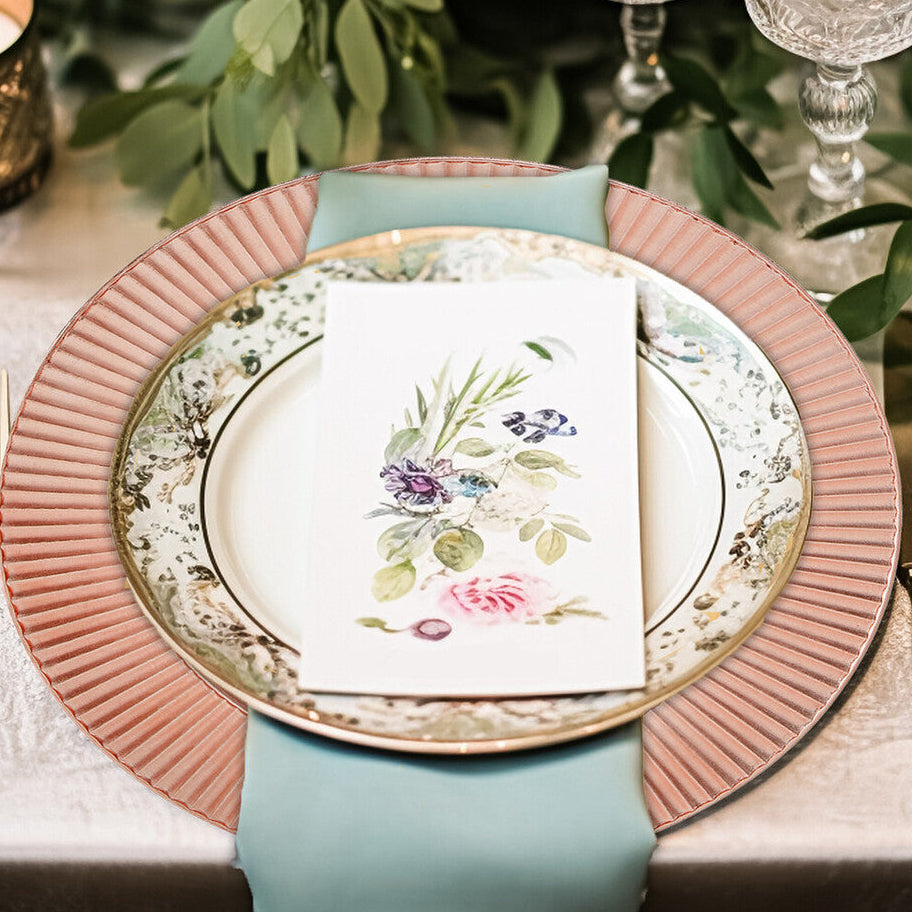 Rose gold charger plate shown from above with etched pattern visible