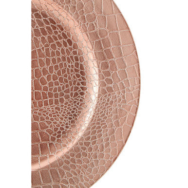 Close-up detail of the pebble-effect texture on the rose gold charger plate