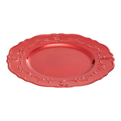 Red baroque charger plate shown from above with scrollwork visible