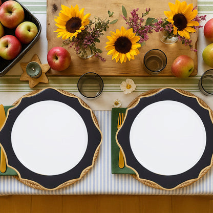 White and black charger plate laid beneath a dinner plate