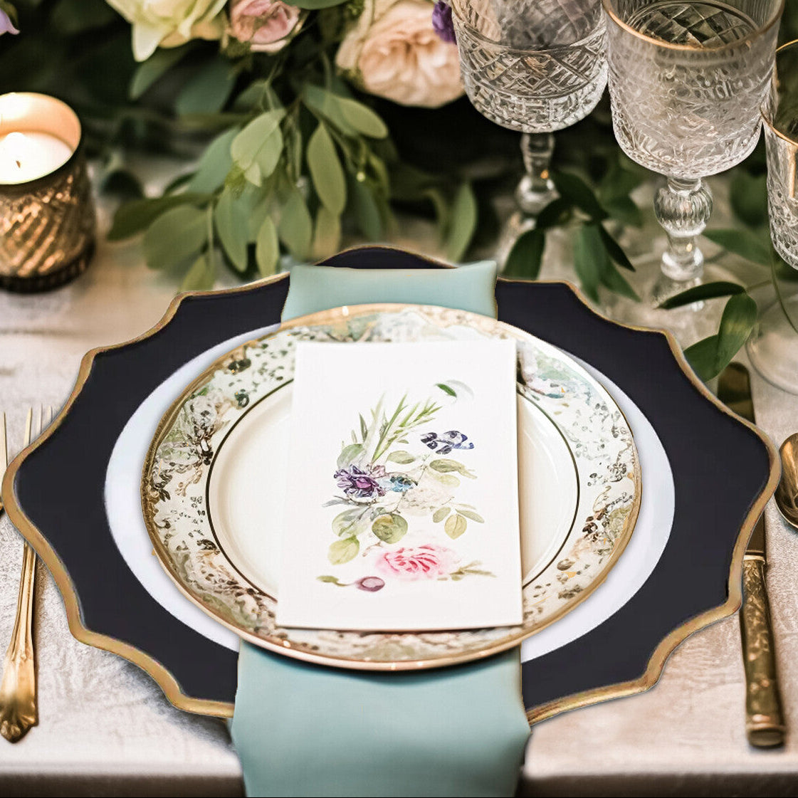 White and black scalloped charger plate shown from above