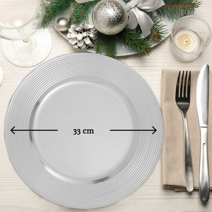 Silver charger plate styled with tableware for a formal dinner setting