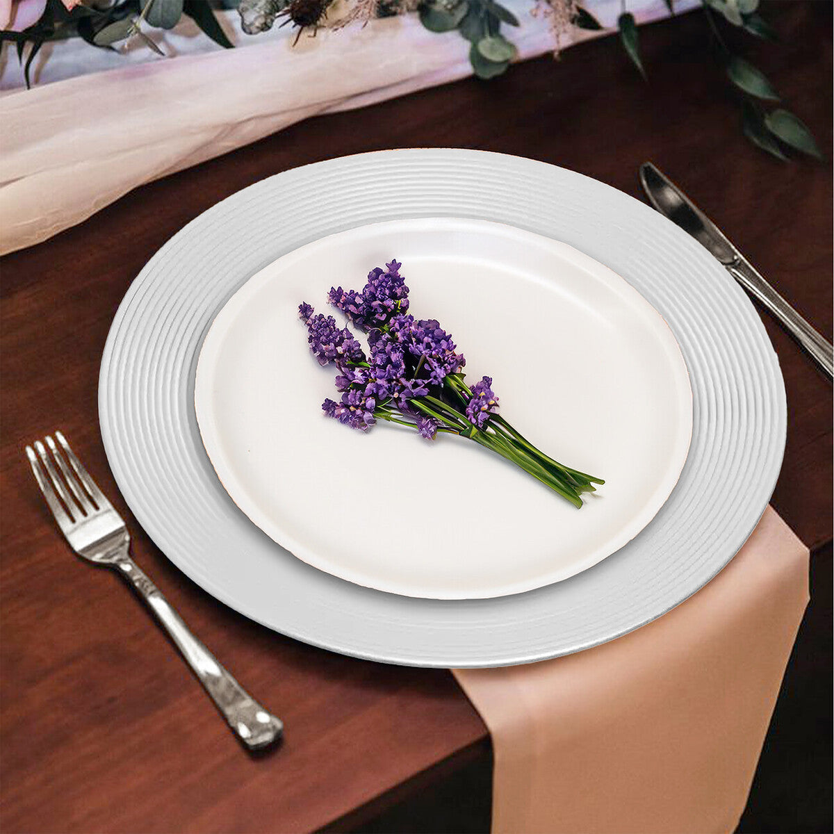 Silver ribbed charger plate styled on a dining table