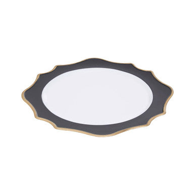 Black and white scalloped charger plate shown from above