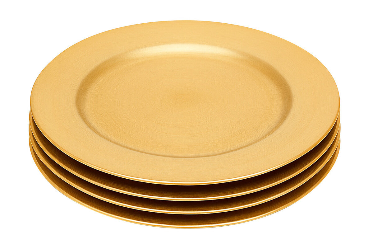 Gold charger plate styled on a dining table as part of a place setting