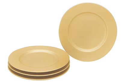 Gold charger plate laid beneath a dinner plate in a table setting