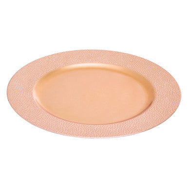 Close-up detail of the pebble-effect texture on the rose gold charger plate