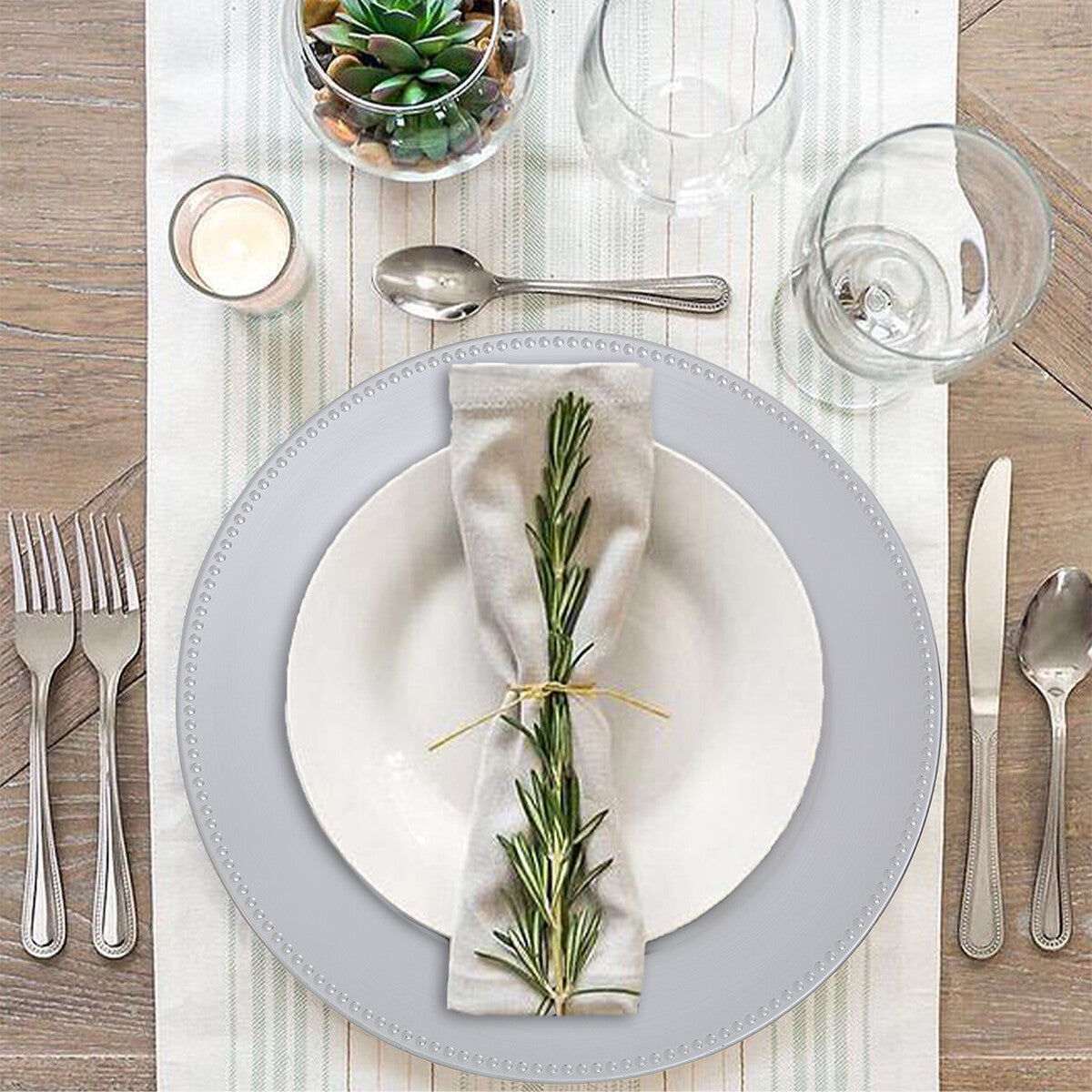 Silver dotted charger plate styled on a dining table