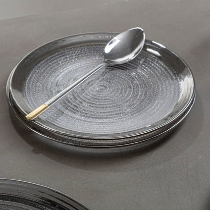 Clear embossed glass charger plate with a silver rim, 33cm diameter