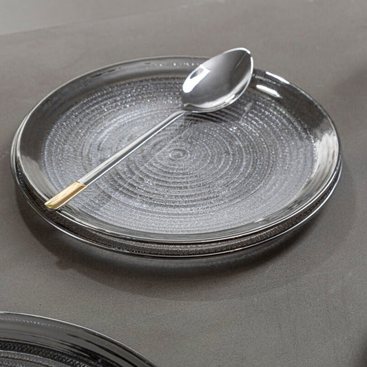 Clear embossed glass charger plate with a silver rim, 33cm diameter
