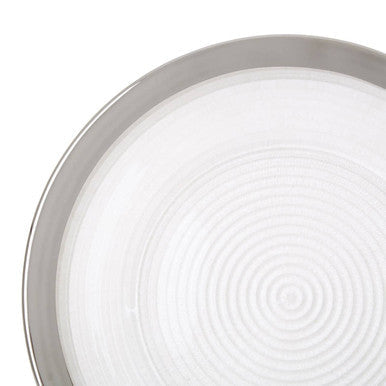 Close-up detail of the silver rim and embossed spiral texture