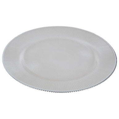 White glass charger plate shown from above with ribbed texture visible