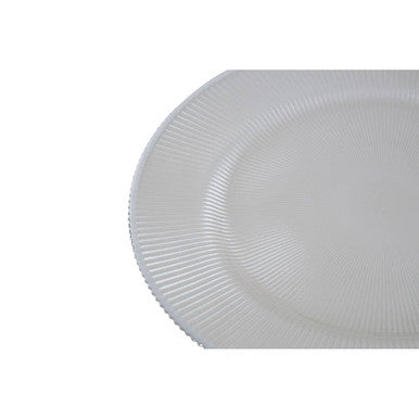 Close-up detail of the silver rim and embossed texture on a white glass charger plate