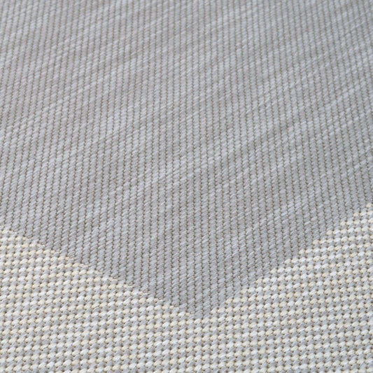 Close-up of grey fabric with a subtle pattern