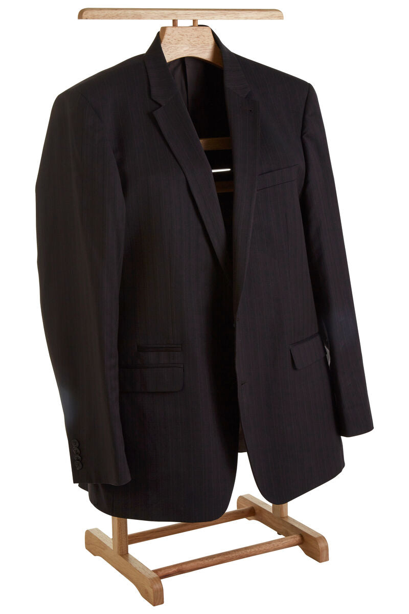 A black pinstripe suit jacket displayed on a wooden hanger and stand against a plain white background.