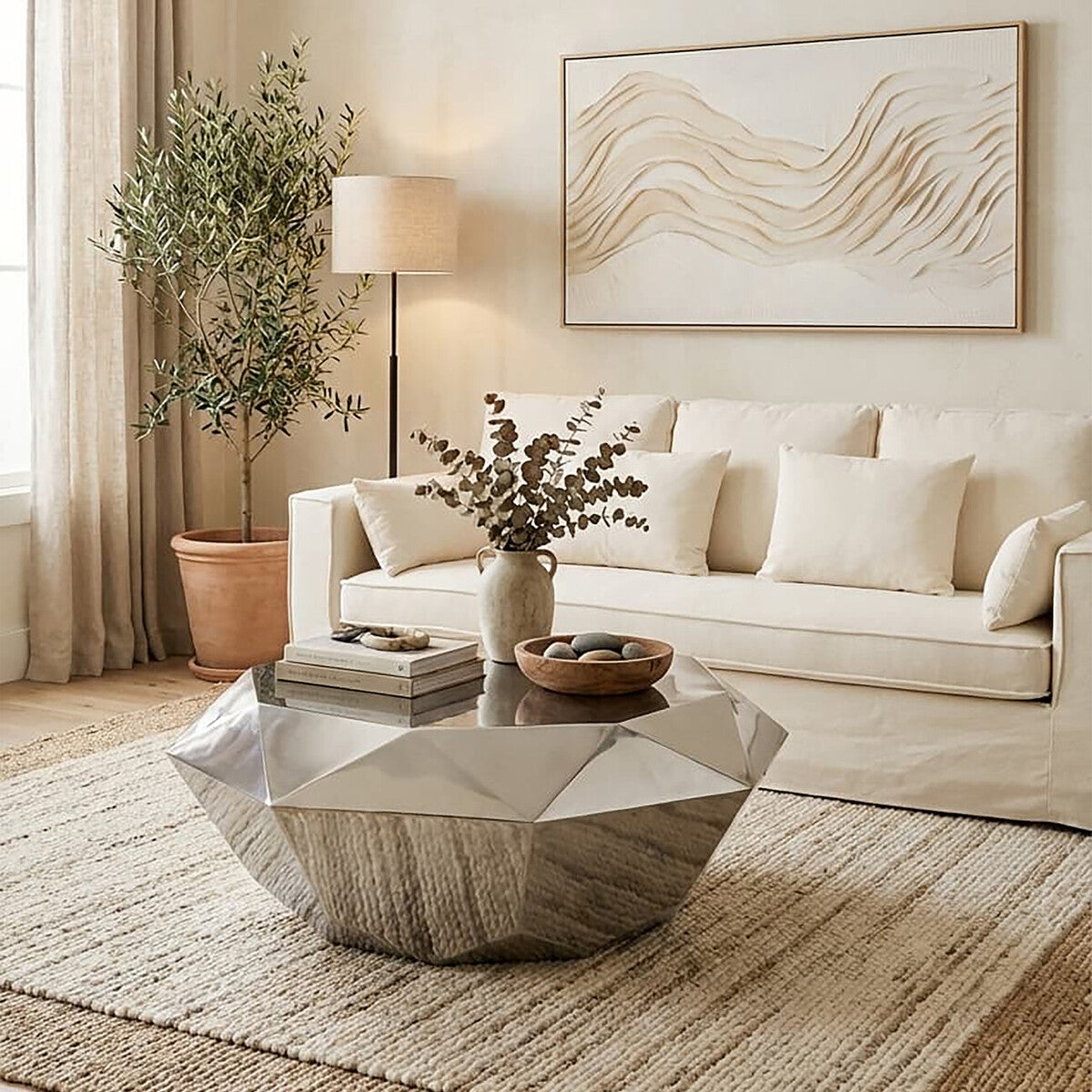 Modern living room with a beige sofa, geometric coffee table, and abstract wall art.